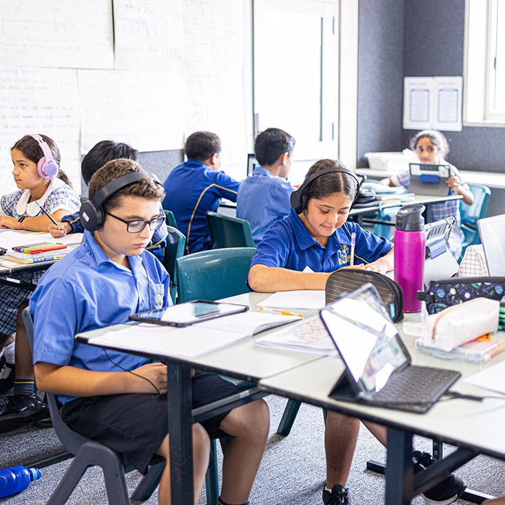 Students using their devices in the classroom at Our Lady of Mount Carmel Primary School Wentworthville
