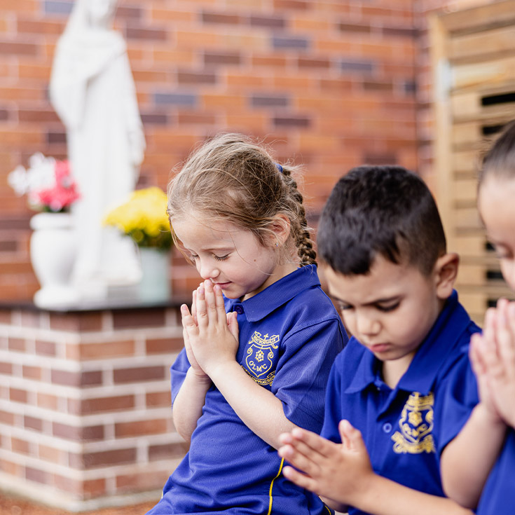 Students in the prayer garden at Our Lady of Mount Carmel Primary School Wentworthville