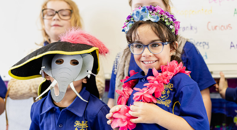 Students playing dress ups in before and after school care at Our Lady of Mount Carmel Primary School Wentworthville