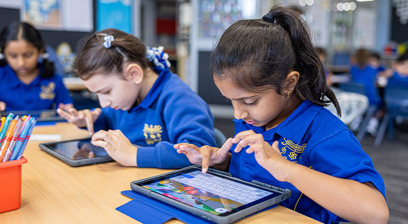 Student using her tablet in the classroom at Our Lady of Mount Carmel Primary School Wentworthville