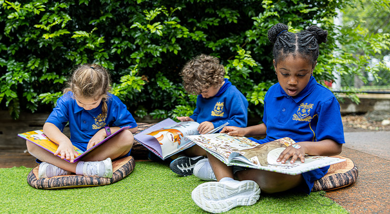Students reading outside at Our Lady of Mount Carmel Primary School Wentworthville