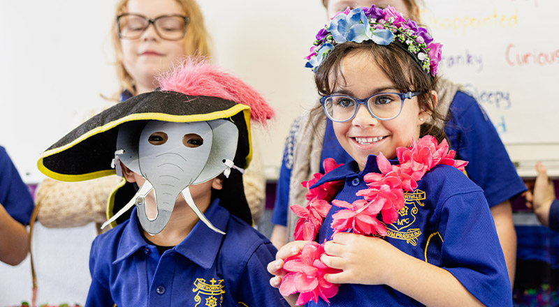 Students playing dress ups in before and after school care at Our Lady of Mount Carmel Primary School Wentworthville