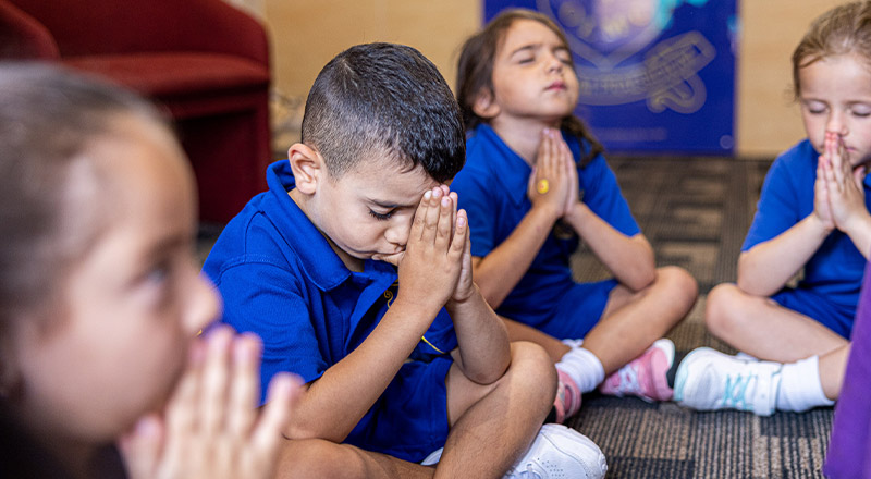 Students praying in class at Our Lady of Mount Carmel Primary School Wentworthville